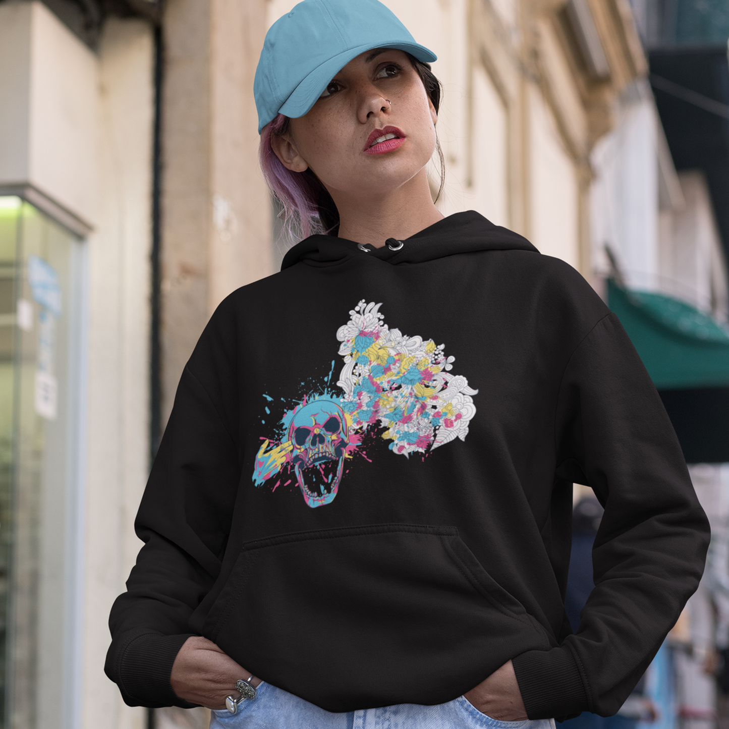 color splash floral skull hoodie featuring a bold skull graphic surrounded by vibrant, colorful flowers, blending edgy design with natural beauty for a unique, eye-catching style.