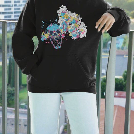 Color Splash Floral Skull Hoodie featuring a bold skull graphic surrounded by vibrant, colorful flowers, blending edgy design with natural beauty for a unique, eye-catching style.